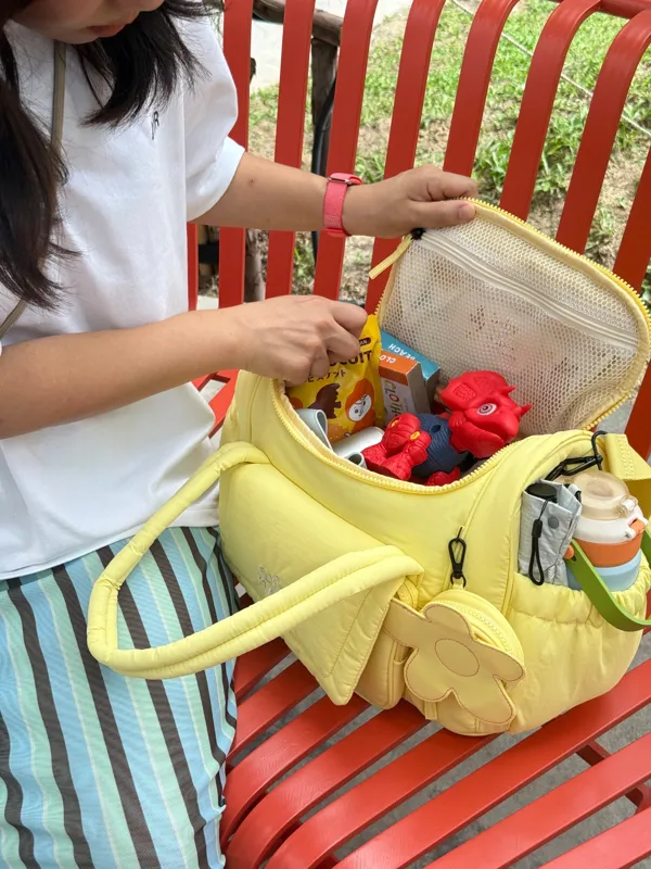 Banana Pudding bag opened, packed with toys and snacks